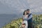 A bride and groom enjoy a view of mount hood in the background from this high elevation winery vineyard