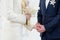 Bride and groom exchange wedding rings