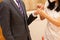 Bride and groom exchange Wedding Rings in church during the christian wedding ceremony