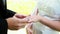 Bride and groom exchanging wedding rings