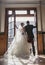 Bride and groom in front of vintage doors