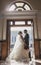 Bride and groom in front of vintage doors