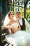 The bride and groom in the gazebo in the park