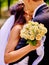 Bride and groom giving flower outdoor