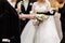 Bride, groom and guests holding glasses with champaign. wedding day. High quality photo