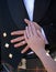 Bride and groom hands resting on groom stomach