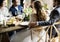 Bride and Groom Having Meal with Friends at Wedding Reception