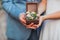 Bride and groom hold Casket with flowers