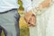 Bride groom holding hands closeup