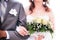 Bride with groom holding wedding bouquet