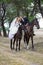 Bride and groom on the horses