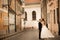 Bride and groom hugging in the old town street. Weding couple in love. Weeding in Budapest
