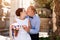 Bride and groom kissing outdoors. Wedding day of happy bridal couple, newlywed woman and man embracing with love in the