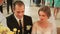 Bride and groom kneel before the altar and saying oaths during wedding ceremony