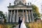 The bride and groom leave the church after the wedding