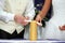 Bride and groom light the wedding candle at the ceremony