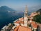 The bride and groom looks out from the window of the ancient tower in the old town of Perast