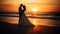 Bride and groom, newlyweds, honeymoon on the beach sunset