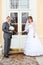 Bride and groom open doors