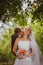 Bride and groom in a park kissing.couple newlyweds bride and groom at a wedding in nature green forest are kissing photo