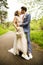 Bride and groom in a park kissing.couple newlyweds bride and groom at a wedding in nature green forest are kissing photo portrait.