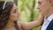 Bride and groom pose in the wood