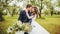 Bride & groom posing near bicycle