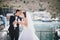 Bride and groom posing with white wedding doves