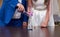 Bride and groom pouring colorful bead into the bottle. Sand ceremony variation