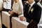 Bride and groom preparing for communion on knees at wedding ceremony in church