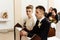 Bride and groom preparing for communion on knees at wedding ceremony in church