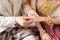 Bride and Groom putting wedding ring on finger, Thai wedding engagement ceremony