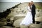 Bride and groom on rocks, Baltic Sea