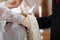 Bride and groom\'s hands and priest\'s cassock