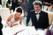 Bride and groom signing registry