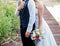 Bride and Groom standing outdoor at wedding day