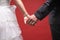 Bride and groom standing together with heart