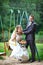 Bride and groom on swing