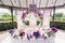 Bride and groom table setting and flower decoration. Presidium of newlyweds outdoors