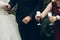 bride and groom toasting with champagne glasses at wedding reception. gorgeous wedding couple newlyweds cheering having fun and d