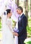 Bride and Groom Under wedding arch