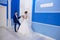 The bride and groom are waiting for the beginning of their marriage. A man in a blue suit carefully holds his beloved by