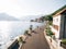 Bride and groom walk along the asphalt road along the coast of Perast. Montenegro