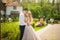 The bride and groom on a walk in the summer. Newlyweds in the park. Summer wedding in nature, Ukraine, Dnipro