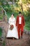 Bride and groom are walking to guests at banquet, arm in arm. Start wedding party. Decoration style, red marsala.