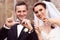 Bride and groom writing LOVE with their fingers