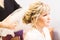 Bride at hairdressing salon making wedding headdress