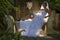 A bride with hairlight sitting on a concrete bench