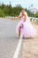 Bride hitching on a road