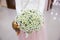 Bride holding beautifil wedding bouquet